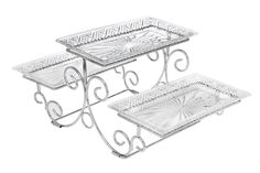 three tiered glass trays with wrought designs on each side, one holding two serving dishes