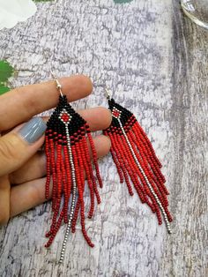 Red Beaded Fringe Dangle Earrings, Red Beaded Fringe Drop Earrings, Red Beaded Tassel Drop Earrings, Traditional Red Jewelry With Fringe, Traditional Red Fringe Jewelry, Red Beaded Earrings With Tassels And Round Beads, Red Beaded Earrings With Tassels, Red Beaded Dangle Earrings With Tassels, Traditional Red Beaded Tassel Earrings