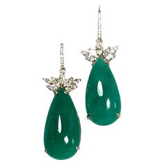 Emeralds Maravellous 56.27 Carats Diamond, Pear-Shaped Cabochon Natural Colombian Emerald Drop Earrings A pair of 18k yellow gold ear dangle, each fitted with bishop diamond 0.12cts hook at the top, set with marquise diamonds and pear-shaped cabochon emeralds. Total diamond weight 1.97 cts. Diamond color H/SI1 clarity, and the Colombian emeralds 54.18 cts. Excellent medium vivid green color. The emeralds are certified by CDTEC stating that they are of Colombian origin with moderate clarity enhan Green Diamond Earrings With 17 Jewels For Formal Events, Green Diamond Earrings With 17 Jewels For Formal Occasions, Luxury Pear-shaped Earrings For Formal Events, Luxury Pear-shaped Earrings For Formal Occasions, Luxury Oval Diamond Earrings For Evening, Luxury Diamond Gemstone Earrings For Party, Luxury Diamond Gemstone Earrings For Formal Occasions, Luxury Diamond Earrings With Gemstones For Formal Occasions, Luxury Hallmarked Diamond Earrings For Formal Occasions