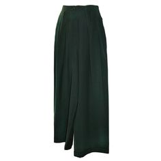 Claude Montana Forest-green high-waisted wide-leg trousers have details of double pleats stitched flat, on the front. Sized 42/8.   Outer-leg waist-to-hem measures 44", inter-crotch-to-hem measures 30 1/2". Width of legs are 23 1/4" with two hidden deep pockets.   Waist-to-crotch front measures 14 3/4", waist-to-crotch back measures 18 1/8". Waist measures 28 1/4". Green Montana, Claude Montana, Trousers Pants, Trouser Pants, Edgy Fashion, Wide Leg Trousers, Forest Green, Montana, Harem Pants