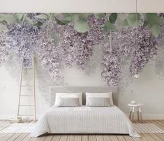 a bedroom with purple flowers on the wall