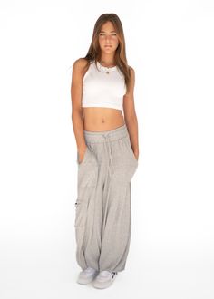 Introducing our Palazzo Pant, aka the pant of the summer. Made from an ultra soft cotton blend, it pairs perfectly with the Ribbed Racerback and Cropped Crew. You will never want to take them off and we don't blame you. Oversized fit Adjustable drawstring at the waist and ankle Made in Los Angeles Sporty Full-length Yoga Pants With Elastic Waistband, Cheap Wide-leg Parachute Pants With Elastic Waistband, Sporty High-waist Parachute Pants With Elastic Waistband, Relaxed Fit Wide-leg Parachute Pants With Elastic Waistband, Relaxed Fit Full-length Parachute Pants With Elastic Waistband, Palazzo Pant, Fashion Joggers, Palazzo Pants, Turks And Caicos Islands