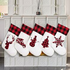 four christmas stockings hanging from a fireplace mantel