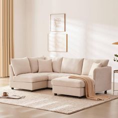 a living room with a sectional couch and rug