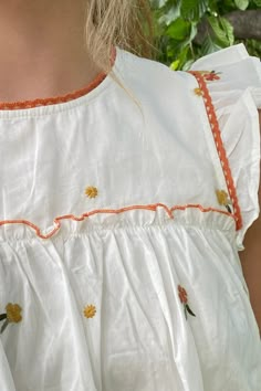 Romantic and cottage core vintage inspired cream embroidered floral printed ruffle top with round neckline, ruffle flounce accents on sleeves and hem, with crochet lace accent, and charming rust color floral print throughout. Back keyhole with button closure. Fall vibes! Round neckline Floral printed ruffle top 100% Cotton, 100% lining Cottage Core Clothes, Cottage Core Vintage, Pink Closet, Cottage Core Style, Core Wardrobe, Laced Up Shirt, Sewing Design, Floral Outfit, Rust Color