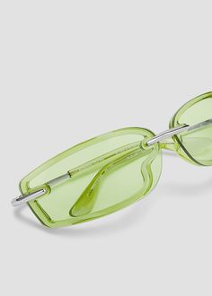 A sleek rectangular silhouette with lenses overlayed on the wrapped frames. Frames are made with combination of durable, lightweight plastic that outlines the silhouette and striking metal details on the nose bridge and temples. Comfortable acetate eartips provide a secure fit. Metal frames with green lenses. Classic Green Rectangular Sunglasses, Modern Green Glass Sunglasses, Elegant Green Rectangular Sunglasses, Bonnie Clyde, Green Lenses, Metal Frames, The Nose, Nose Bridge, Metal Frame