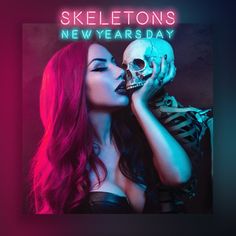 a woman with red hair and skeleton makeup is kissing her face in front of a neon sign that reads skeletons new years day