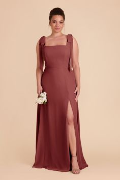 a bridesmaid in a long dress with one leg slited and the other side split