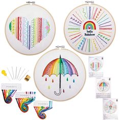 three embroidery kits with different designs and colors on the front, one has an umbrella