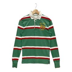 PLEASE ASK ANY QUESTION BEFORE BUYING  THIS IS USED CLOTHING PLEASE DONT EXPECTED IT TO BE LIKE NEW OR IN PRISTINE  Vintage!! Polo Ralph Lauren Rugby Embroidery Sweater Sweatshirt Tag Ralph Lauren  Material Cotton Size on tag S (small) Measures About ( Approximately)  -Armpit to Ampit : 17 inch -Length (back collar down) : 27 inch Condition : used good condition  9/10 **No Tears No Stains And No Hole** PLEASE READ THE DESCRIPTION AND POLICY BEFORE BUYING ACCEPT PAYMENT:  💥PAYPAL ONLY 💥ALL ITEM Green Embroidered Long Sleeve Tops, Green Long Sleeve Sweatshirt With Embroidered Logo, Green Long Sleeve Sweatshirt With Embroidered Graphics, Long Sleeve Tops With Embroidered Graphics For College, Embroidered Long Sleeve Tops For College, Red Long Sleeve Top With Embroidered Logo, Green Long Sleeve Top With Embroidered Logo, Green Embroidered Tops For Winter, Vintage Long Sleeve Tops With Embroidered Logo