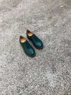 "These women's shoes, known as Brogue Oxfords Tie Shoes, are made of soft dark green leather, giving them a bold and unique look. The intricate brogue detailing on the leather adds a touch of sophistication and refinement to these women shoes, making them perfect for formal occasions or business settings. The shoes feature a comfortable rubber sole, making them versatile enough for any occasion, whether it's a casual weekend outing or a formal business meeting. With their striking dark green color and timeless brogue design, these shoes are sure to become a statement piece in any fashion-forward woman's wardrobe. Key features: 1. Handcrafted in our workshop in Kyiv. 2. Made from 100% natural soft leather. 3. Removable insole, so you can use your own orthopedic insole. 4. Fits true to size Green Round Toe Oxfords For Office, Green Leather Shoes With Leather Sole For Fall, Green Round Toe Oxfords For Work, Green Oxfords For Work With Round Toe, Green Leather Sole Loafers With Plain Toe, Green Plain Toe Loafers With Leather Sole, Green Plain Toe Leather Shoes For Work, Green Lace-up Oxfords For Derby, Green Leather Sole Dress Shoes For Office