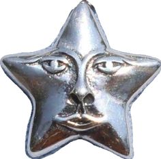 a silver metal star ornament with a face