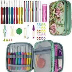 an open case filled with lots of colorful markers and crochet hooks next to other items