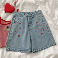 High rise denim shorts with cute floral embroidery on the front. Button and zip up front with belt loops, side pockets and back pockets. Cut open button hole with scissors S: 24.5" waist, 36" hips, 12" rise, 22" thighs, 4" inseamM: 26" waist, 37.5" hips, 12" rise, 23" thighs, 4" inseamL: 27.5" waist, 39" hips, 12" rise, 24" thighs, 4" inseam Trendy High-waisted Floral Embroidery Jean Shorts, Trendy High-waist Jean Shorts With Floral Embroidery, Trendy High Waist Floral Embroidered Shorts, Casual Floral Embroidery Jean Shorts For Spring, Trendy Denim Shorts With Floral Embroidery, Trendy High Waist Jean Shorts With Floral Embroidery, Casual Denim Jean Shorts With Floral Embroidery, Spring Denim Blue Shorts With Floral Embroidery, Spring Denim Blue Floral Embroidery Shorts