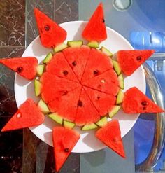 watermelon slices arranged on a white plate