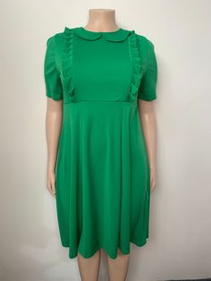 Plus Size Women Ruffle Edge Solid Dress - The Little Connection Green Ruffled Dresses For Work, Spring Dress With Ruffles And Peter Pan Collar, Spring Dress With Peter Pan Collar And Ruffles, Green Fitted Ruffle Dress With Short Sleeves, Fitted Green Ruffle Dress With Short Sleeves, Green Ruffled Midi Dress For Work, Summer Dresses With Ruffles And Peter Pan Collar, Green Midi Dress With Ruffles For Work, Elegant Green Mini Length Ruffle Dress