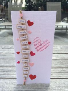 a valentine's day card with scrabbles and hearts attached to it