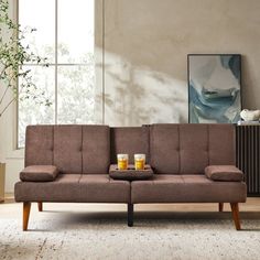 a living room scene with focus on the couch and coffee table in the center area