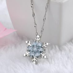 Specification:Gender: WomanColor: Sky Blue , Sea BlueMaterial: Zinc Alloy, Zircon, CrystalThickness: 0.5cm (0.19")Length: 23cm + 5 (extend chain )Pendant Diameter: 2cm ( 0.78")Net Weight: 6gOccasion: Party, Birthday, Anniversary, Gift, Daily Wearing etc.Package includes: 1pcs x Necklace Notes:1. Please note the photo does not show actual size, please refer to Description for size details. 2. Please allowed 1-5mm differences due to manual measurement, thanks.3. Due to the difference between diffe Cheap Blue Necklaces With Star Charm, Blue Jewelry For Christmas Party, Blue Christmas Party Jewelry, Blue Necklace For Christmas Gift, Blue Jewelry For Christmas Gift, Blue Jewelry Christmas Gift, قلادات متدلية, Snowflake Necklace, Snowflake Pendant