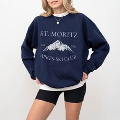 This St Moritz Ski Club sweatshirt is the perfect way to elevate your ski wardrobe and pay tribute to the alpine elegance of St Moritz Switzerland. Crafted for comfort and style, this Saint Moritz Crewneck is perfect for après-ski gatherings or casual outings in the charming town. Immerse yourself in the spirit of the wonderful ski season, whether you're hitting the slopes or cozying up by the fire. Ideal for any situation, a unisex heavy blend crewneck sweatshirt is pure comfort. These garments are made from polyester and cotton. This combination helps designs come out looking fresh and beautiful. The collar is ribbed knit, so it retains its shape even after washing. There are no itchy side seams on these sweaters.  - 50% cotton, 50% polyester - Medium-heavy fabric (8.0 oz/yd² (271.25 g/m Sporty Winter Sweater With Logo Print, Winter Sports Sweater With Logo Print, Winter Sports Sweatshirt, Sporty Sweatshirt For Winter Sports, Long Sleeve Ski Tops For Ski Season, Long Sleeve Skiing Tops For Ski Season, Long Sleeve Tops For Ski Season And Winter Sports, Long Sleeve Tops For Ski Season, Casual Crew Neck Sweater For Ski Season