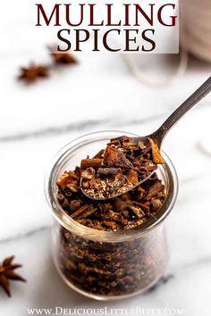 a glass jar filled with granola sitting on top of a table