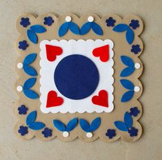 a paper plate with blue, red and white designs on it