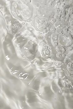 an image of water that is very close to the camera lens and it looks like bubbles