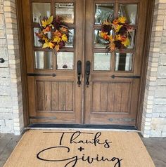 a welcome mat with the words thanks and giving written on it in front of a door