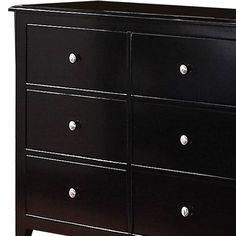 a black dresser with silver handles and knobs on the bottom drawer, against a white background