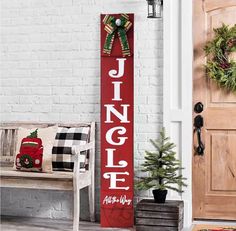 a sign that says happy holidays next to a bench and christmas wreath on the door