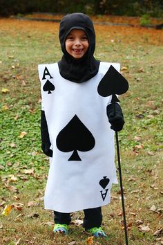 a child dressed up as a card costume