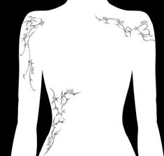 the back of a woman's body with flowers on it