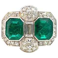 Stunning Art Deco Platinum Ring featuring exquisite Colombian Emeralds Design: Timeless Art Deco elegance Gems: 2 vivid green emeralds, each weighing approximately 1.60 carats Certification: Comes with a GRS Gemological Certificate (GRS2024-047503) confirming the emeralds are Vivid Green with Minor Oil Treatment This exquisite piece is a perfect blend of vintage charm and modern sophistication. Ideal for collectors and connoisseurs of fine jewelry. Rings Art Deco, Bijoux Art Deco, Emerald Ring Engagement Diamond, High Jewelry Ring, Estate Rings, Platinum Diamond Rings, Detailed Jewelry, Ring Art Deco, Diamond Cocktail Rings