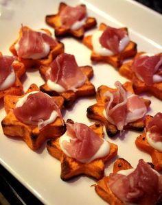 small appetizers are arranged on a white plate