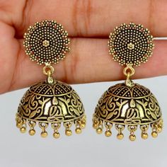 Wedding Collection Traditional Oxidised German Gold Plated Handmade Jhumka Brass Earrings Earring Length 4 Cm, Width : 1.5 Cm Weight: 20 Gram Metal: Brass Plating: Oxidised Gold Occassion: Party Wear, Fuction Wear Style: Jhumka Earring Care Instruction : Avoid Heat & Chemicals Like Perfume, Deo, Alchol, Etc And Clean With Dry Cotton Cloth, Pack In A Air Tight Container After Use. Gold Dual-tone Chandbalis, Gold Dual-tone Danglers, Dual-tone Bridal Earrings As Gift, Heavy Drop Earrings Jhumkas, Heavy Drop Jhumkas, Festive Dangle Jhumkas, Elegant Jhumkas For Festive Occasions, Elegant Heavy Jhumkas For Festival, Elegant Festival Jhumkas