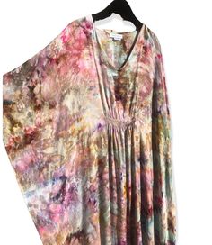 "One of a kind caftan, individually ice dyed using shibori tie techniques. Gauzy lightweight rayon is ethereal and drapey. Fabric is semi-sheer. Soft v-neck with smocking detail at front & back to add shape. Fluttery side seams. Super light and packable- perfect for travel, or for a WFH comfy dress. Flowy and voluminous but with enough shape that it doesn't look sloppy. Measurements- One Size Fits Many. Chest 28\" flat, Center Front Length 55\", Center Back Length 58\". You will receive the Bohemian Tie Dye Spring Kaftan, Casual Flowy Tie-dye Kaftan, Casual Tie Dye Kaftan For Spring, Casual Tie-dye Kaftan For Spring, Spring Casual Tie-dye Kaftan, Casual Spring Tie Dye Kaftan, Tie Dye Flowy Kaftan For Beachwear, Tie Dye Flowy Kaftan For Beach Cover-up, Flowy Tie Dye Kaftan For Beachwear