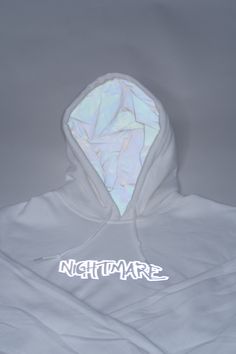 O.G White Nightmare logo hoodie. Our cotton hoodie is lined with versatile white reflective fabric. The reflective logo design features a collection of hands reaching dreams/goals. Perfect for lounging, activewear, events, and meetings. Stay warm, stay fly, you're their worst Nightmare. White Hooded Techwear Sweatshirt, White Techwear Hooded Hoodie, White Techwear Hoodie With Drawstring, Techwear Style White Sweatshirt For Streetwear, White Hoodie With Adjustable Hood For Streetwear, White Hoodie With Double-lined Hood For Streetwear, White Adjustable Hood Hoodie For Streetwear, Reflective Fabric, Tactical Clothing