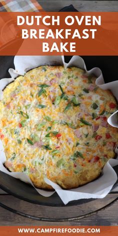 a close up of a pie in a pan on a table with the words dutch oven breakfast bake