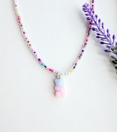 This super adorable gummy bear charm necklace is the perfect gift for any girls who love to accessorize with fun colorful beads!  How to order Just add to cart! The necklace has an extender so you can choose how long or short you like it! Please reach out with any questions! Playful Beaded Charm Necklaces For Gifts, Playful Beaded Charm Necklace For Gifts, Playful Beaded Charm Necklaces As Gifts, Playful Pink Charm Necklaces For Friendship, Playful Pink Charm Necklace For Friendship, Rainbow Kawaii Jewelry For Gift, Cute Beaded Charm Necklaces For Gifts, Cute Beaded Charm Necklace As Gift, Pink Charm Necklaces With Colorful Beads As Gift