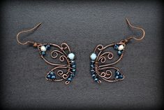 Butterfly Earrings, Copper Earrings, Wire Earrings, Crystal Earrings, Sparkling Earrings, Small Dangle Earrings, Wire Wrapped Earrings ❤️ Totally handmade, cute butterfly earrings They are made of raw copper wires and are oxidized to a beautiful brownish color. They are polished and covered with special metal varnish to protect the color. They are decorated with crystal, sparkling beads. Many beads are available! Please contact me if you would like some other color! ★ Size: Total length (with th Small Wire Wrapped Earrings, Butterfly Wire Earrings, Wire Wrap Butterfly, Unique Butterfly Earrings For Jewelry Making, Wire Wrapped Butterfly, Sparkling Earrings, Wire Jewelry Earrings, Oversized Hoop Earrings, Twist Jewelry