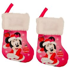 pair of minnie mouse christmas stocking with white fur trimmings and pink background