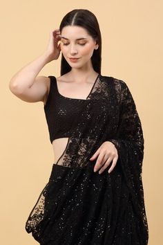 Black pre-stitched saree with embroidered floral patterns highlighted by sequin work. Comes with embroidered blouse. - Aza Fashions Fitted Black Draped Saree, Draped Choli For Parties, Fitted Sleeveless Pre-draped Saree For Festive Occasions, Fitted Sleeveless Pre-draped Saree For Festive Season, Bollywood Style Sleeveless Evening Blouse, Evening Sleeveless Bollywood Blouse Piece, Evening Bollywood Sleeveless Blouse, Festive Pre-draped Saree With Padded Blouse, Sequined Tops With Traditional Drape