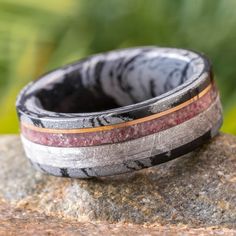 a wedding band made out of wood and marble