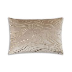 a beige pillow with wavy lines on the front and back, along with a white background