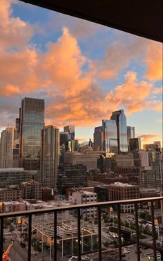 the city skyline is seen from an apartment balcony