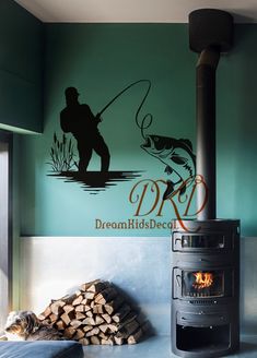 a man fishing on the water next to a fire place and wall decal that says dream kids decor