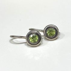 Vintage Sterling Silver Peridot Hook Earrings...Marked 925...Total of weights 1.8grams...Measure H 5/8'' W 2/8''...These are in very good condition. Nickel-free Round Peridot Earrings, Hook Earrings, Sterling Silber, Ear Wires, Vintage Sterling Silver, Etsy Earrings, Gems, Sterling Silver, Crochet