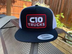 C10 Trucks Snapback Hat Patch Features On trend and adjustable, this snapback cap features a contrast underbill and seven snaps for sizing.| Fabric: 80/20 acrylic/wool, 98/2 cotton/spandex (multicam ® Styles) Features: green underbill, (multicam ® Styles) Structure: structured Profile: high Closure: 7-position adjustable snap (FAST SHIPPING) Fitted Trucker Hat With Flat Brim, Fitted Black Trucker Snapback Hat, Black Fitted Trucker Snapback Hat, Fitted Trucker Baseball Cap With Flat Brim, Fitted Trucker Snapback Hat With Curved Bill, Fitted Trucker Snapback Hat With Flat Bill, Fitted Trucker Snapback Baseball Cap, Fitted Snapback Trucker Hat, Hat Patch