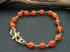 "You will receive 1 Natural carnelian bracelet, Carnelian beaded bracelet, Smooth bead, Gemstone Bracelet, Handmade, Charm Bracelet, Beautiful Gift, Gift For her Stone : carnelian Bracelet Size: 7\" long Many thanks for you visit my store ♥ if you have any question please contact us. For wholesale Price Please Convo me. You can order different items as many you like ." Handmade Orange Agate Bracelets, Handmade Orange Agate Bracelet, Bohemian Carnelian Bracelets With Round Beads, Handmade Carnelian Round Bead Bracelets, Handmade Carnelian Bracelets, Handmade Orange Agate Beaded Bracelets, Beaded Round Carnelian Bracelets, Beaded Round Carnelian Bracelet, Bohemian Carnelian Bracelet In Orange