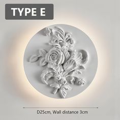 a white wall light with flowers on it and the text type e above it reads d25cm, wall distance 3cm